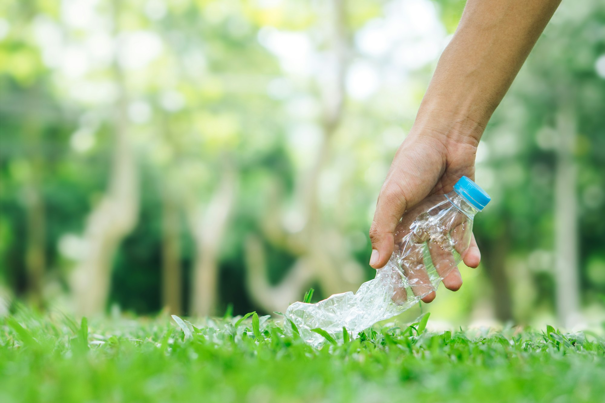 Man hand keep plastic bottle for recycling concept.Ecological waste management.